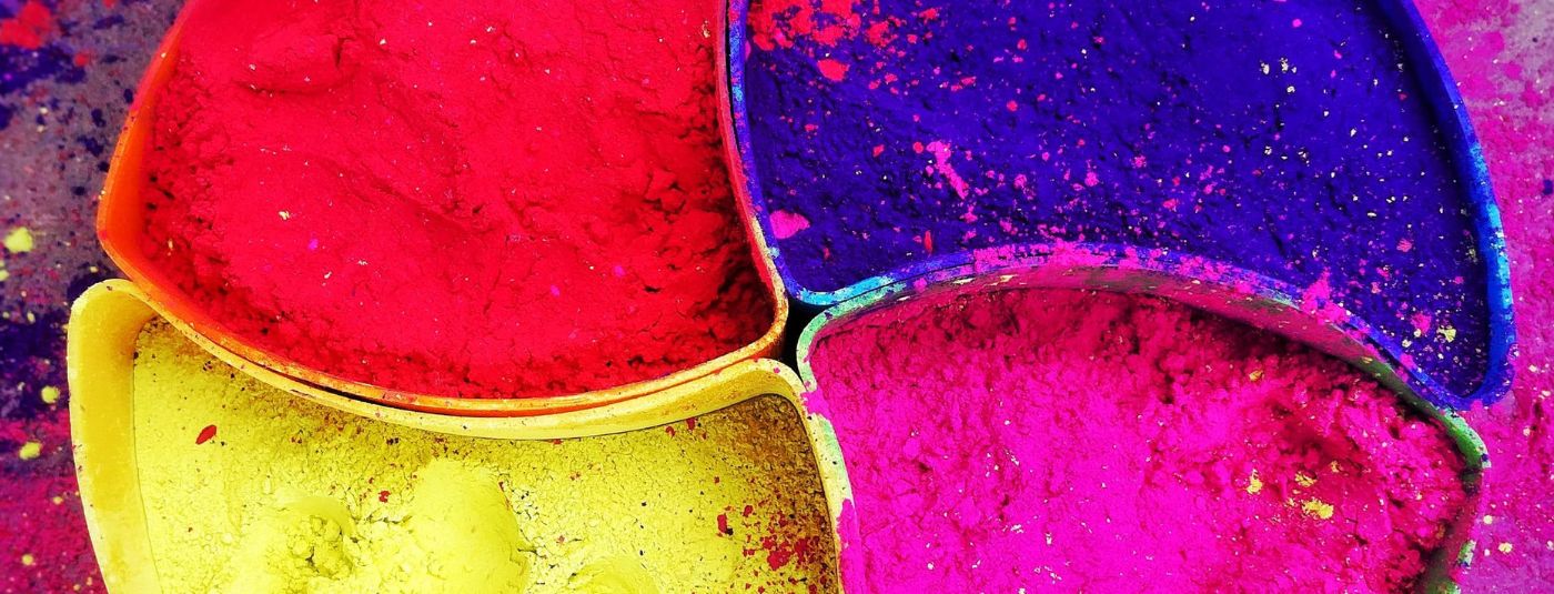 Why is Holi called the festival of colours and what do yellow, pink, green,  blue and purple symbolise?