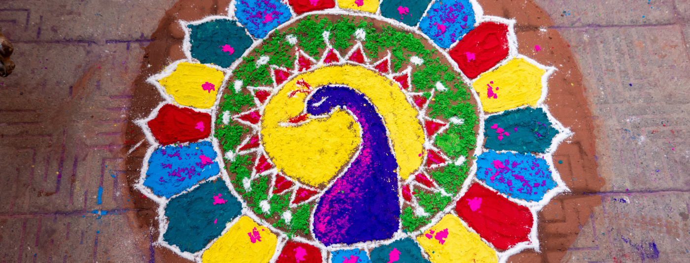 Peacock Rangoli pattern created with vibrant colours