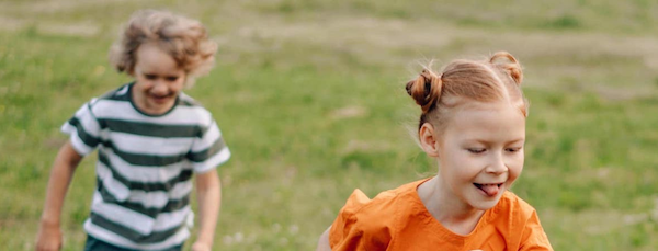 Children running in a field