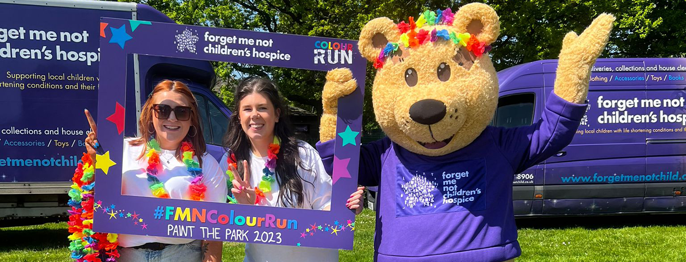 Forget me not mascot with ministry of colours staff