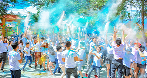 Everyone having a blue holi powder event