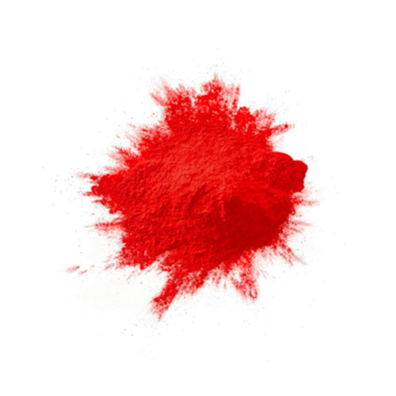 A pile of red coloured powder against a white background.