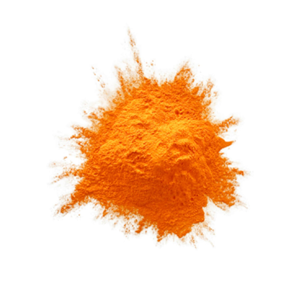 Orange colour powder in a heap on a white background.