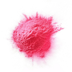 Pink colour powder in a heap on a white background.