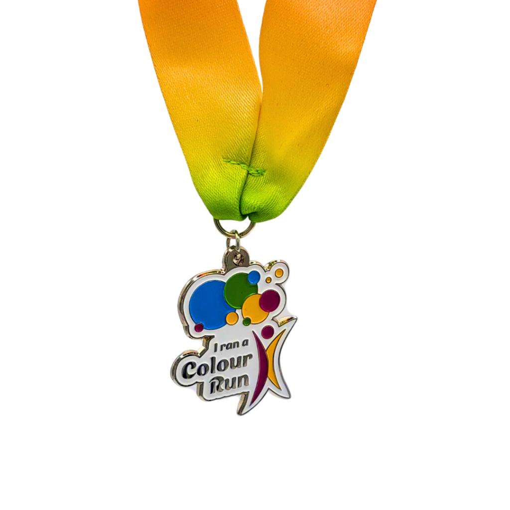 An enamel medal for a colour with the Ministry Of Colours logo that says 'I ran a colour run'.