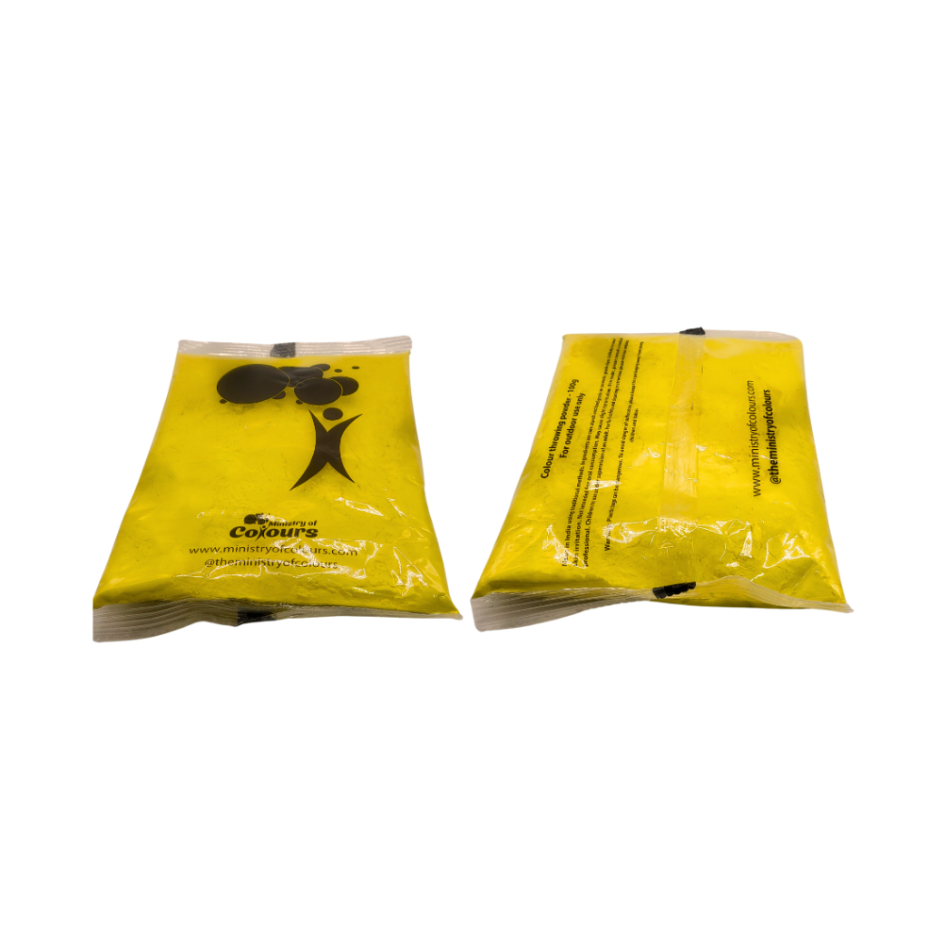 A bag of yellow colour powder from Ministry Of Colours on white background.