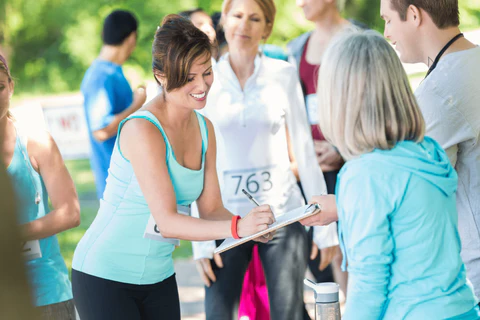 People signing up for a running event.
